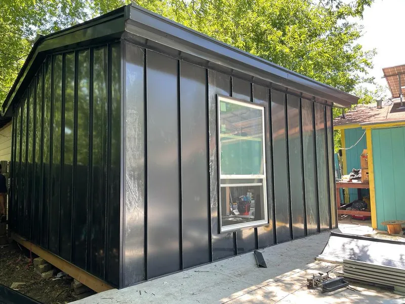 Black standing seam metal wall panels for Roof Inspection in Dumas