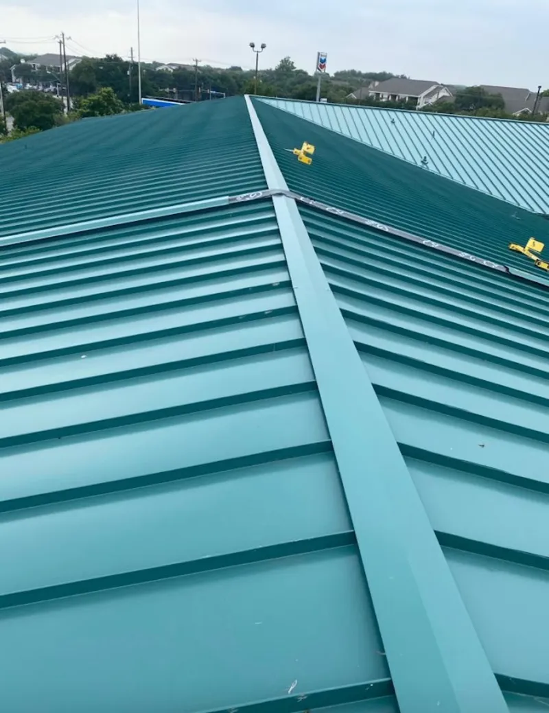 Green commercial metal roof ridge and valley for Metal Roof Repair in Dumas