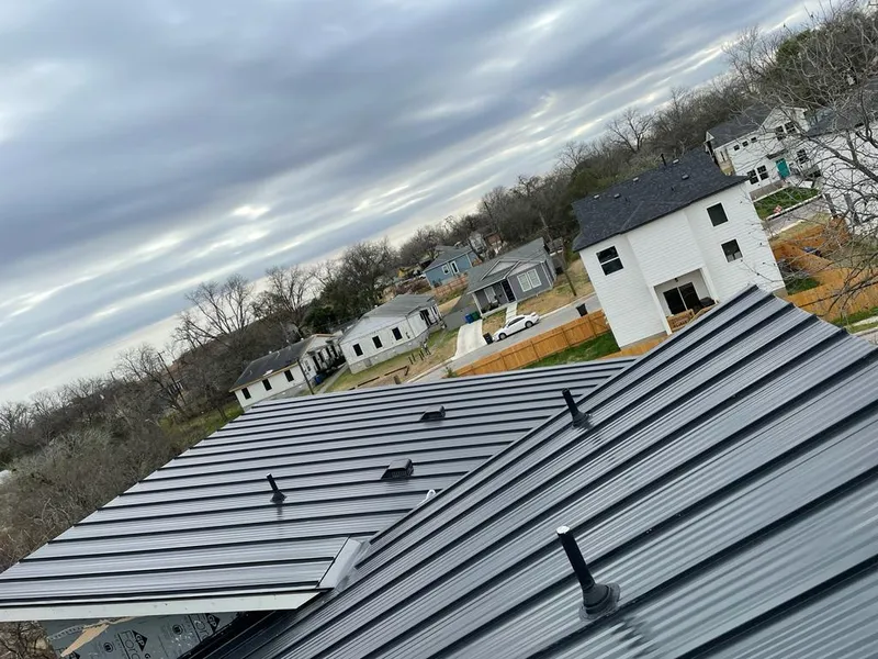Standing seam metal roof panels with vents for Skylight Repair in Dumas